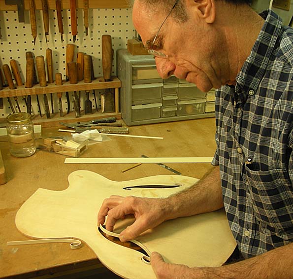 Bob Benedetto works on custom wood binding for a 16-B. (Dec 2010) (Courtesy Benedetto Guitars)