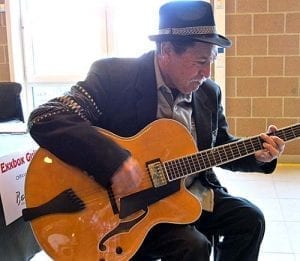 Playing our honey blonde Americana at a Belgium Guitar Show March. (Courtesy Belgium Guitar Show)