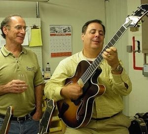Howard performs on the 1st 16-B made (S1832, made for Benedetto Player Bill Moio) while Bob looks on (while enjoying our Miner Happy Hour!) (Courtesy Benedetto Guitars)