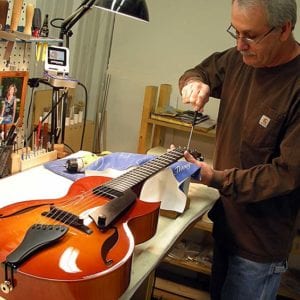 BG's meticulous Final Assembly Whiz Rick Cervone installs the truss rod on a newly finished ANDY ELITE S2026 (this one in Autumnburst rather than the standard Violinburst). (Courtesy Benedetto Guitars)