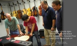 Andreas Varady signs Benedetto Guitar back Sept 2012 as Bob Benedetto Howard Paul Dave Miner look on
