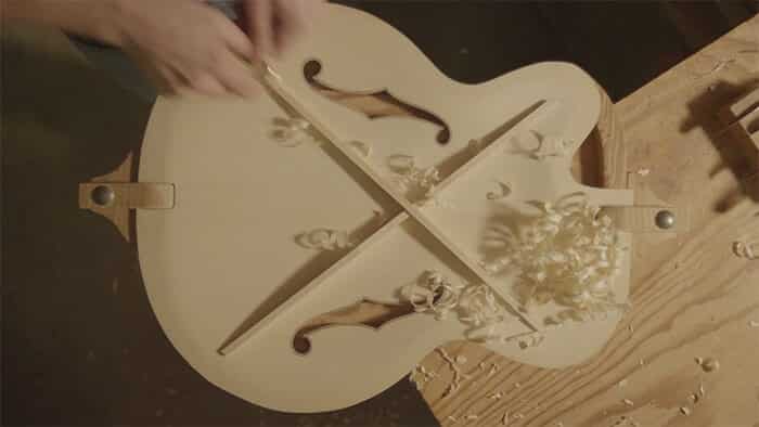 Carving Benedetto guitar top.