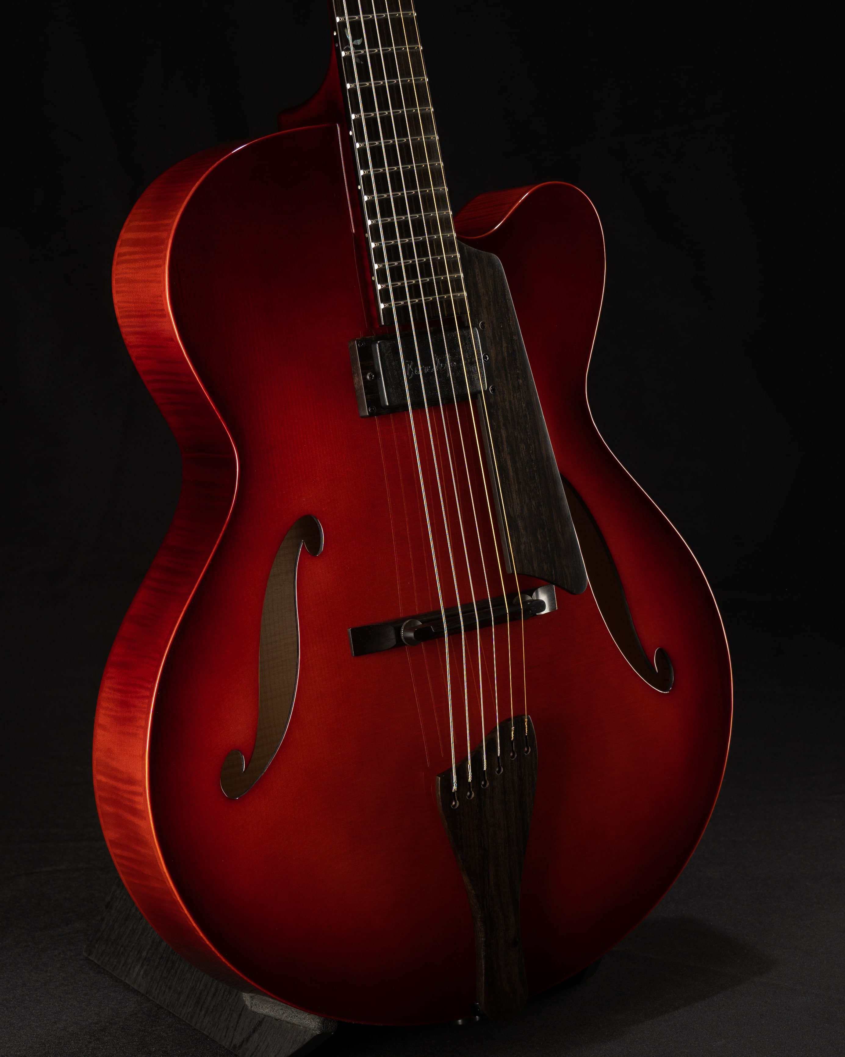Custom Benedetto 16-B jazz guitar with a rich red finish and elegant design, showcasing the blend of features from the Bravo Elite model.