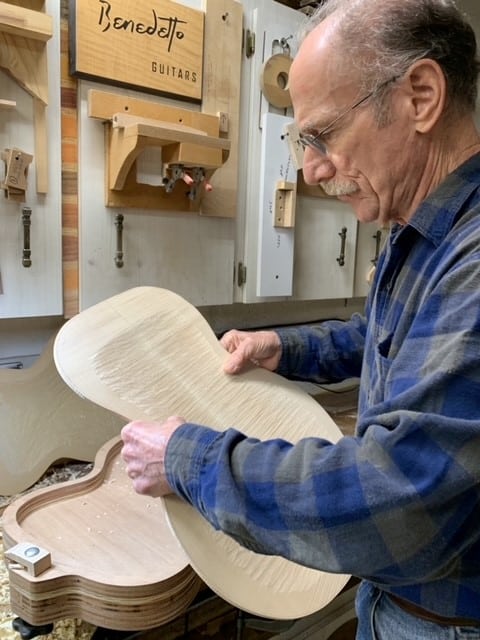 Bob Benedetto inspecting a carved back