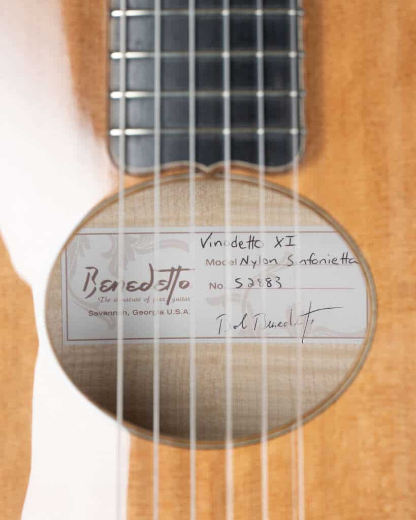 Close up, sound hole and tag