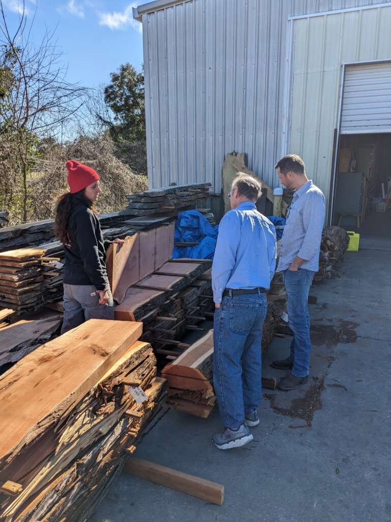 Bob and Damon checking out wood