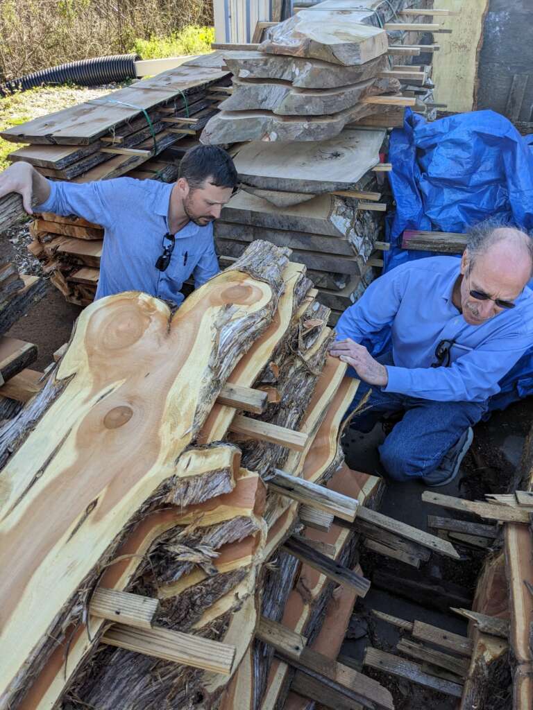 Bob and Damon checking out wood