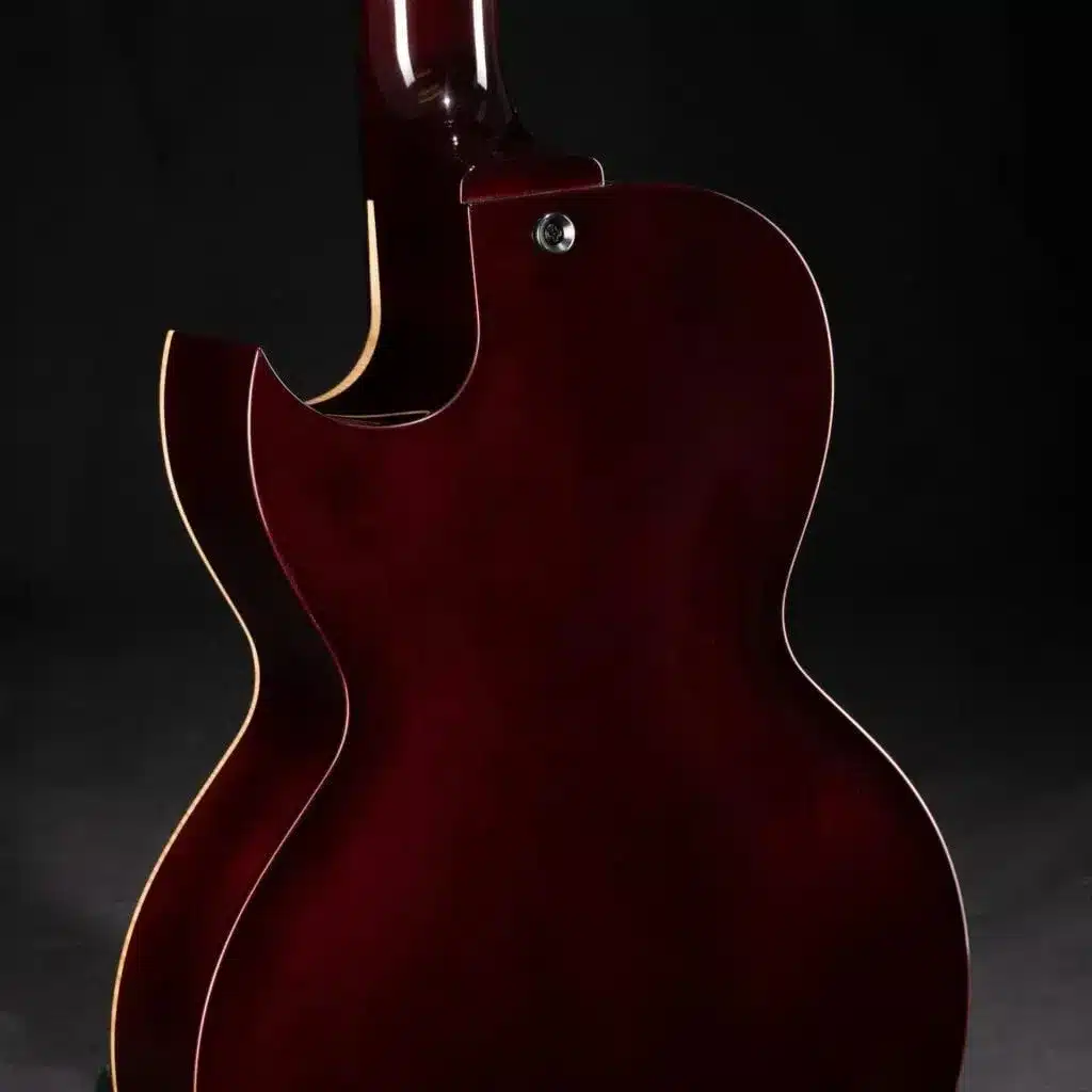 Compact Benedetto archtop guitar with a sunburst finish and single floating pickup