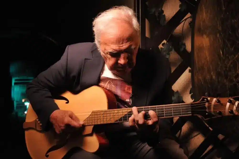 Jazz legend Bucky Pizzarelli playing a natural finish 7-string Benedetto archtop guitar.